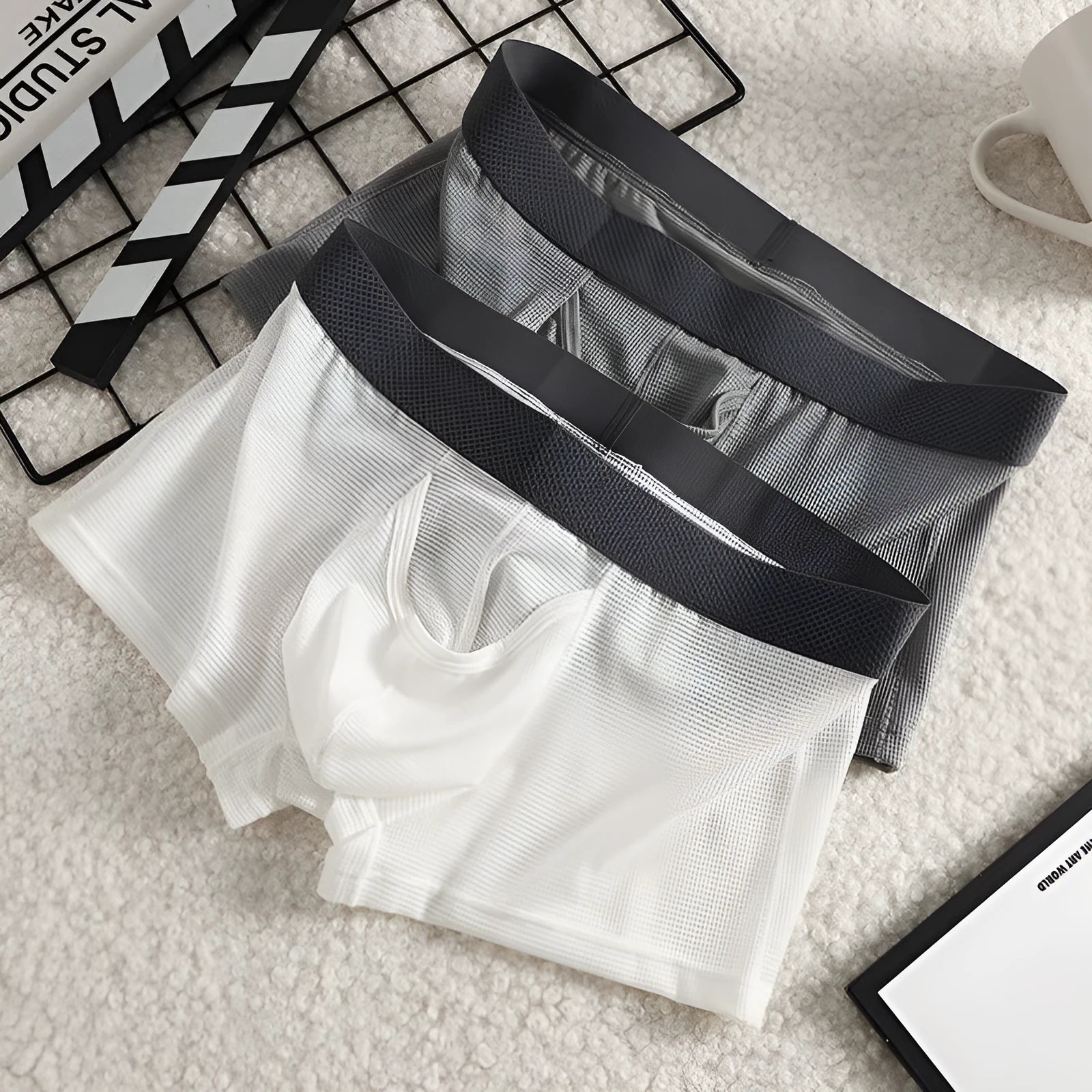 Men's ice silk boxer shorts with mesh fabric in black, white, and grey colour options