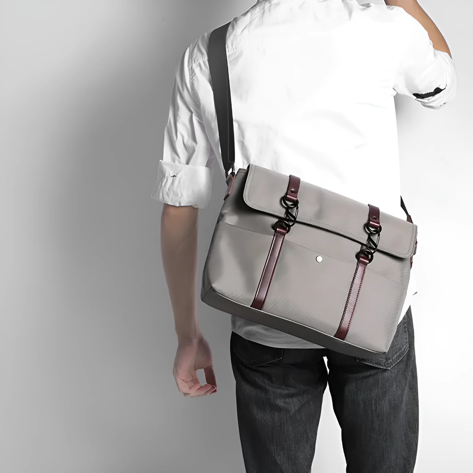 Men's black waterproof tote bag with cross-section square shape, matte finish, and soft handle, designed for 13-inch laptop and business travel