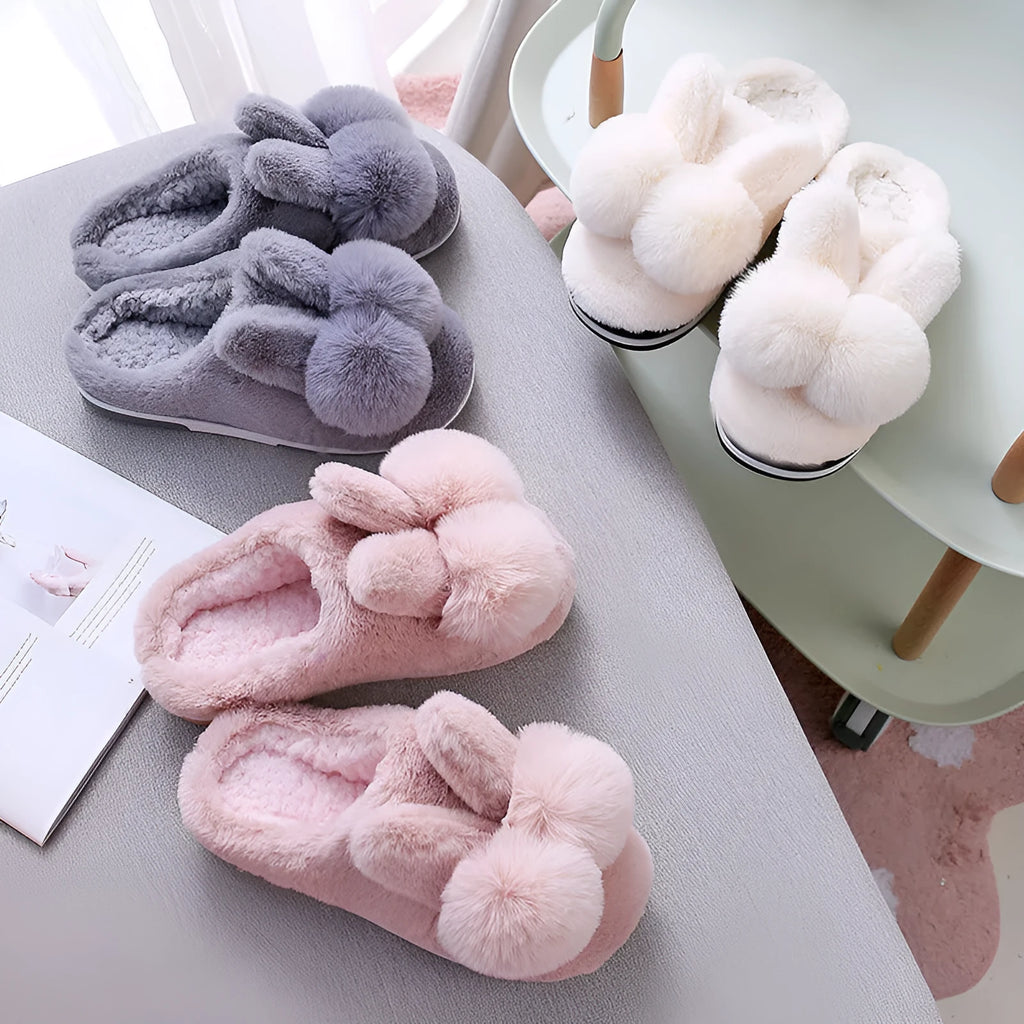 Women's high-top bunny slippers in creamy white with rabbit fur upper and floral detail.