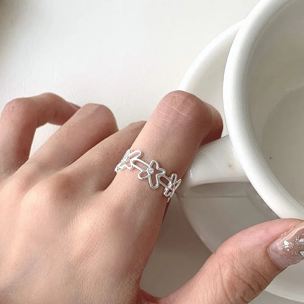 S925 sterling silver irregular hollow-out flower ring with adjustable opening in silver colour