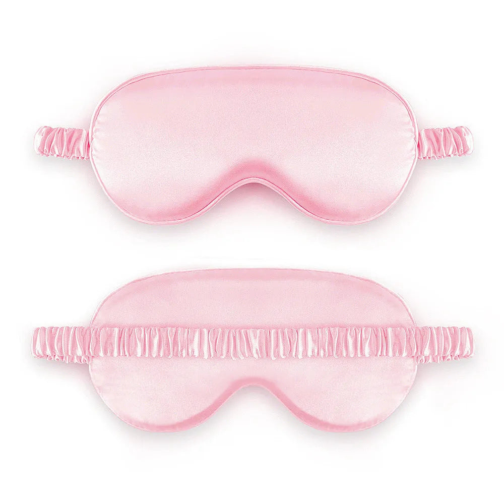 Rayon satin double-sided sleep mask in a selection of solid colours on a white background.