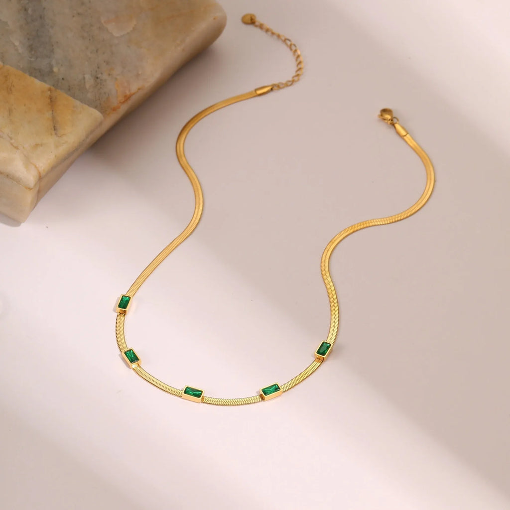 Geometric square zircon pendant on a flat stainless steel snake chain necklace in gold or steel colour.