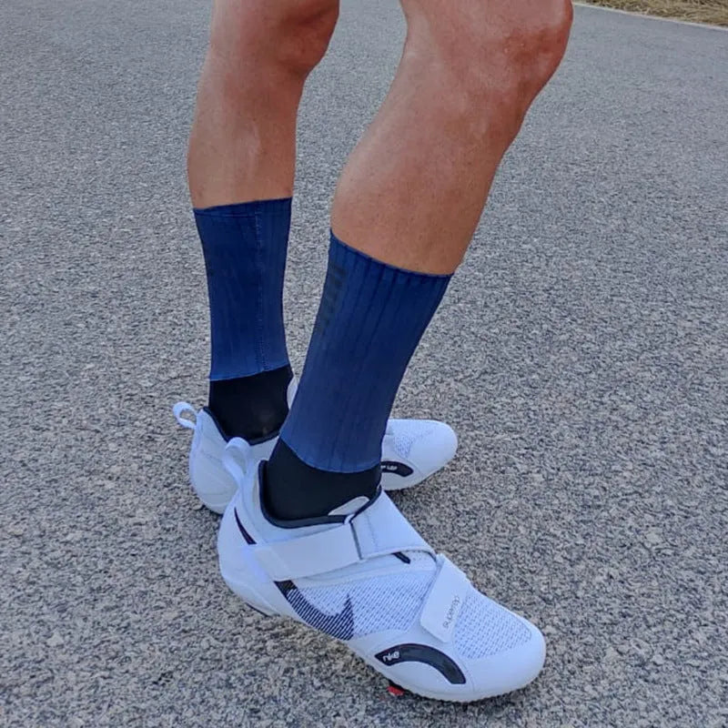 A pair of breathable athletic sports socks for cycling and running, available in six colours.