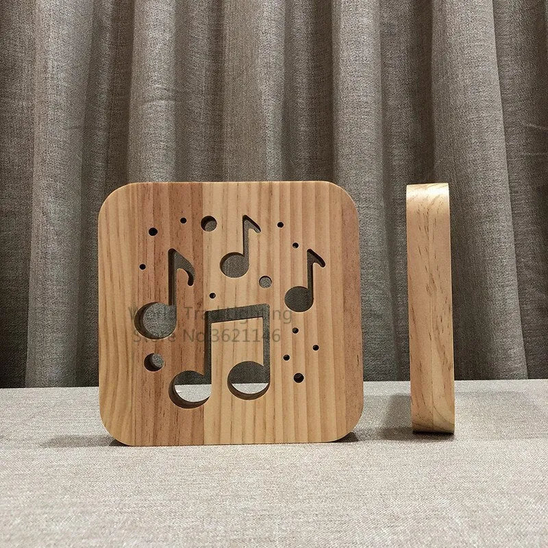 Square pine wood USB LED lamp emitting warm white 3D pattern light on a dark surface.