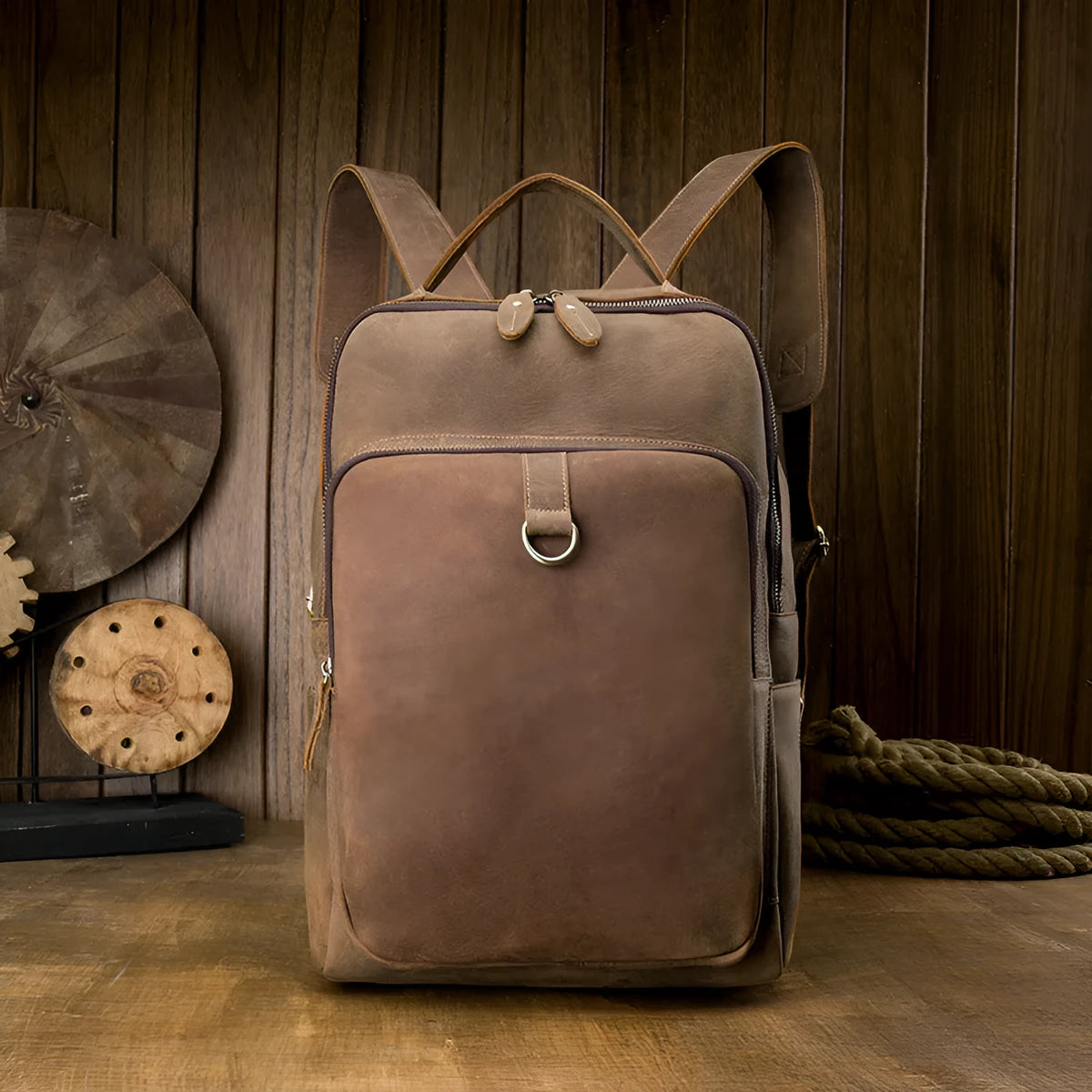 Retro brown leather backpack for men, 20L bucket shape with zipper, laptop pocket and phone pouch.