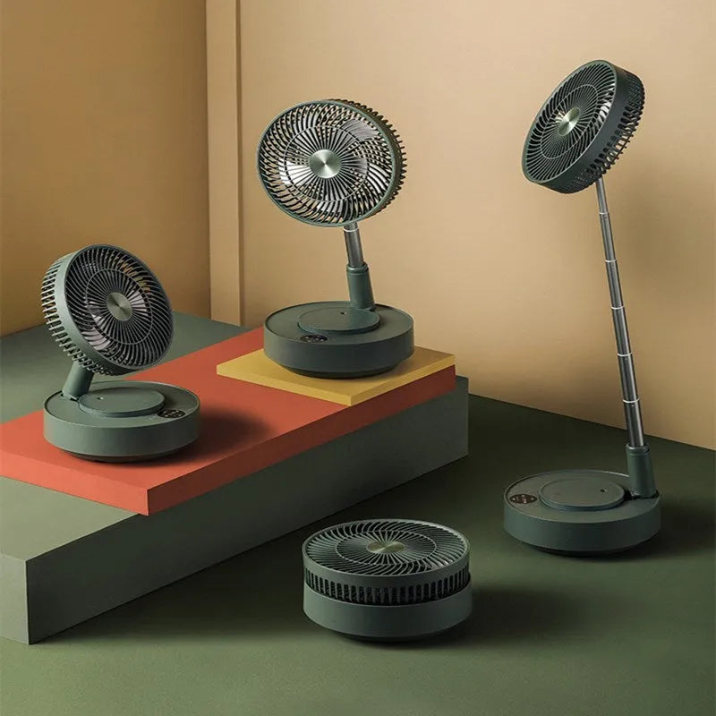 Green telescopic floor fan extended to full height with magnetic remote control attached