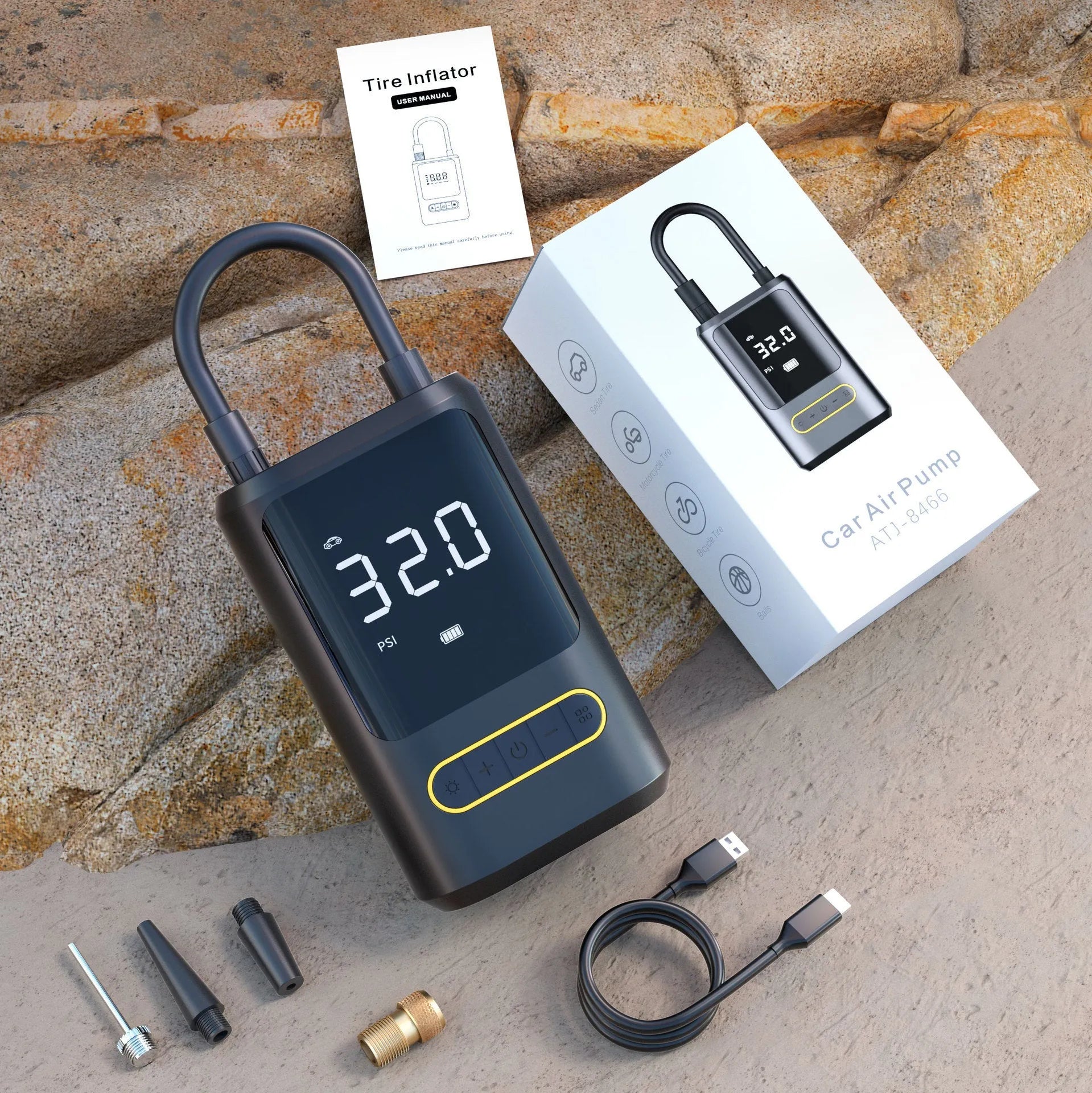 Handheld black digital display wireless car air pump with LED light and nozzle adapters.