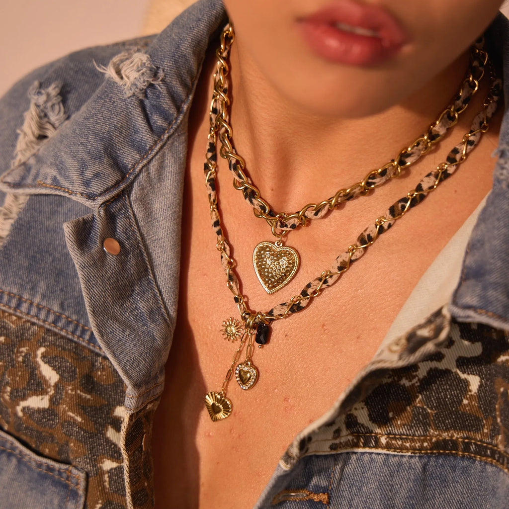 Leopard print geometric heart pendant on a stainless steel chain with adjustable length