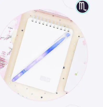 Box of 12 constellation-themed quick-drying gel pens with plastic bodies and coloured caps