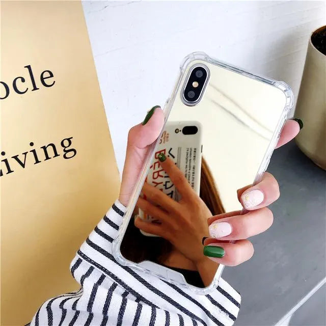 TPU mirror phone case for iPhone on a table, showing anti-fingerprint finish.