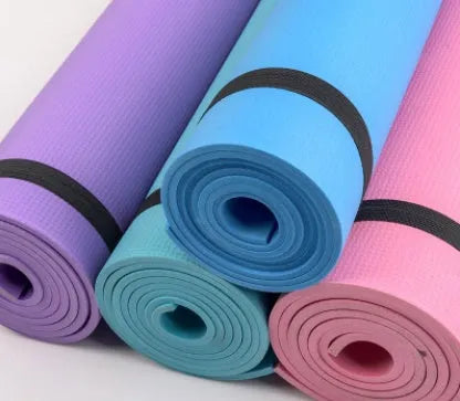 Red EVA fitness composite yoga mat with rolled edge showing 4mm thickness on a wooden floor.