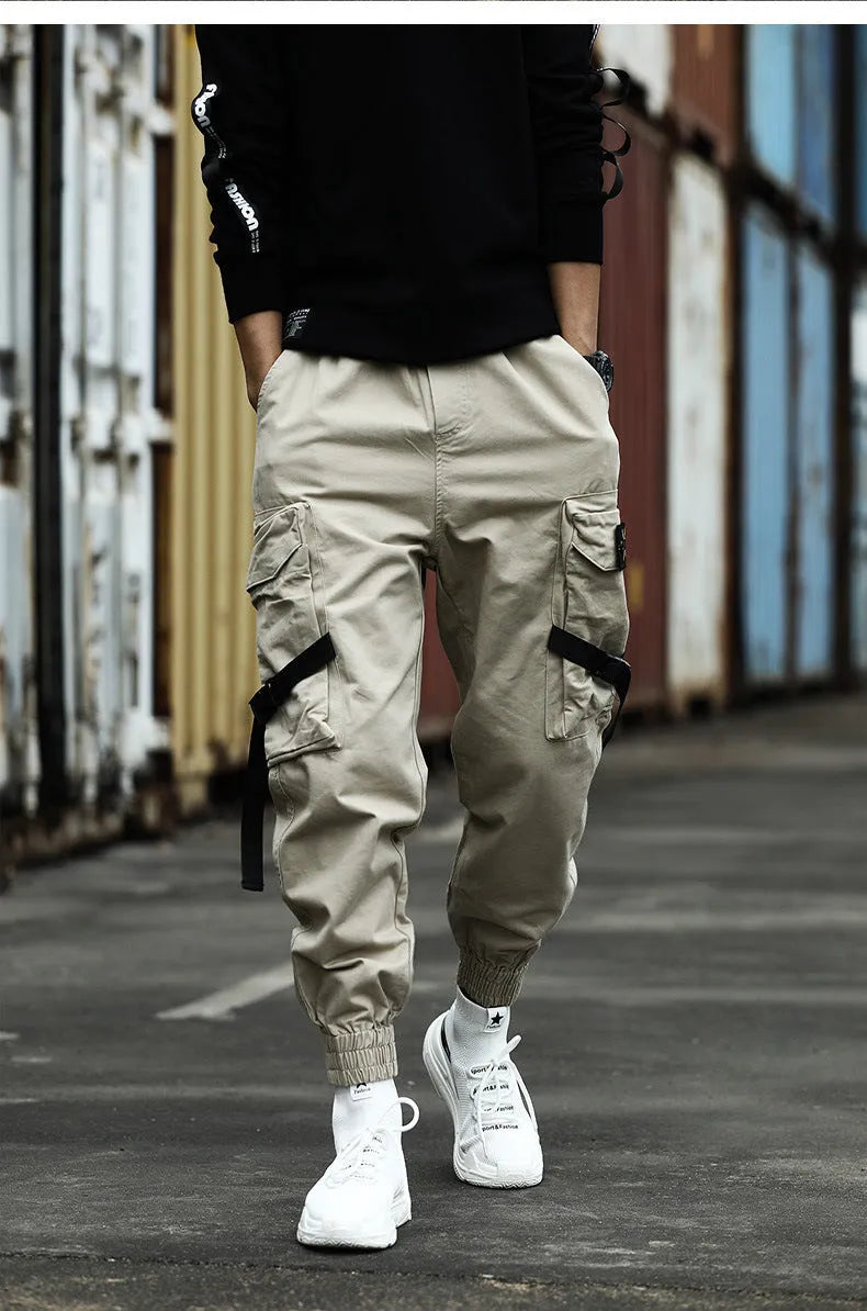 Men's cotton cargo pants in black, grey, and khaki, casual multi-pocket trousers with size chart.