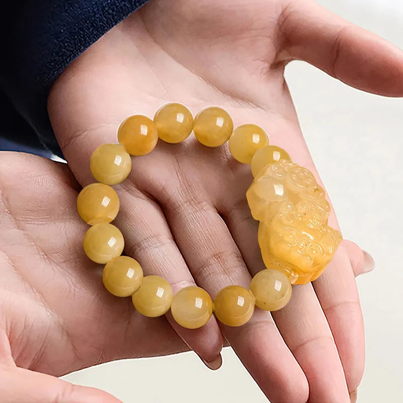 Carved Jinsi Jade money motif bracelet in Golden Thread Jade colour showing 10mm and 13mm bead size options.