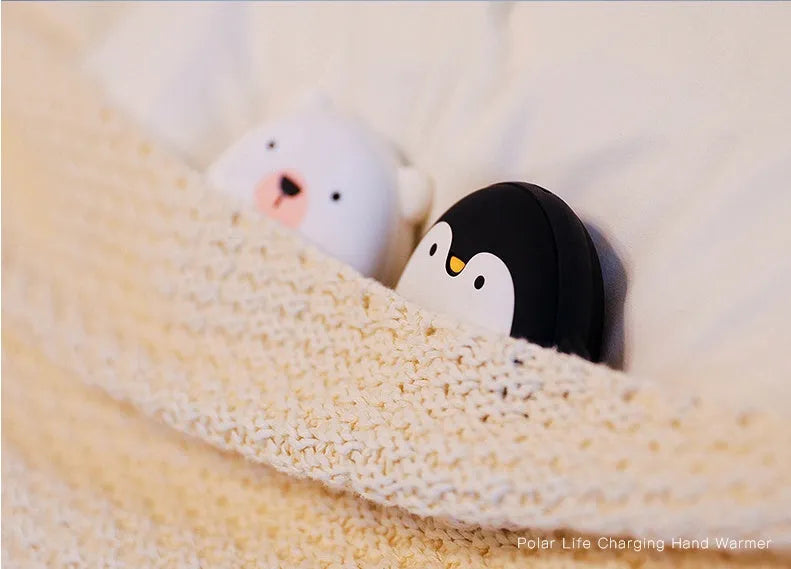 Cartoon penguin and polar bear USB rechargeable hand warmer and power bank showing double-side heating