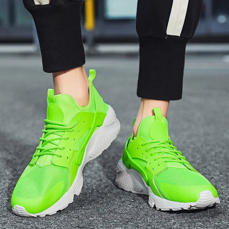 Men's low top mesh sneakers in fluorescent colours on a flat sole
