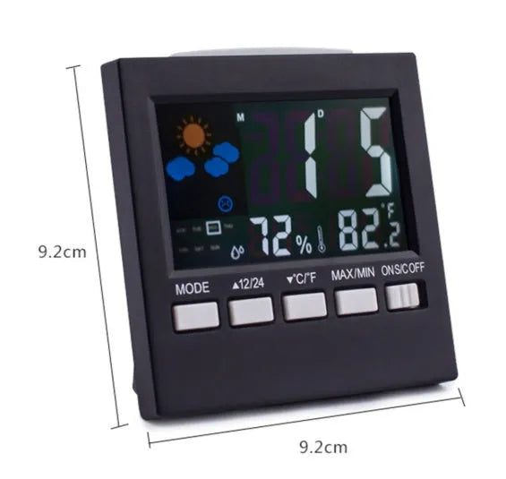 Black multifunctional perpetual calendar clock with alarm, weather forecast, thermometer, and blue backlight on a desk
