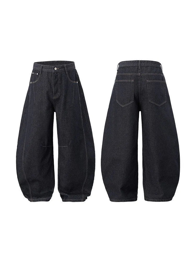 Men's original cow colour wide leg denim trousers laid flat.