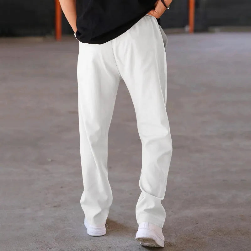 Men's loose straight trousers in waffle polyester with drawstring, available in multiple colours including black and light grey