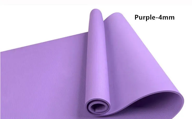 Red EVA fitness composite yoga mat with rolled edge showing 4mm thickness on a wooden floor.