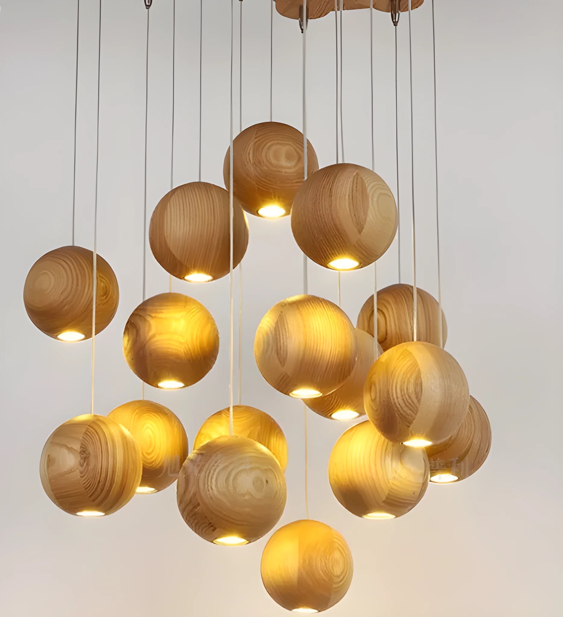 Nordic-style solid wood ball chandelier with adjustable cord and wood disc shade.