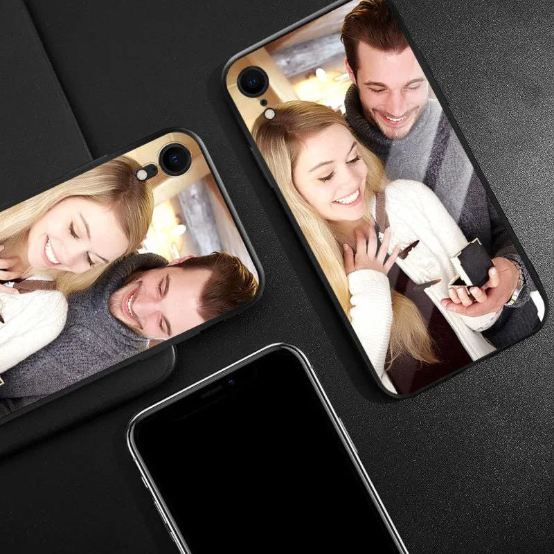 Patterned iPhone case with raised edges on a table next to an iPhone.