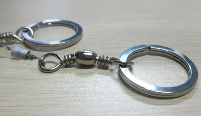 Stainless steel survival wire saw with ring attachments showing 55cm cutting length
