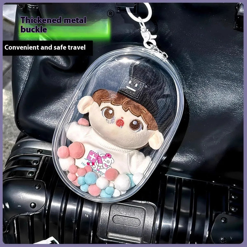 Transparent PVC cube-shaped storage bag with colourful ball keychain for doll drying and organisation.