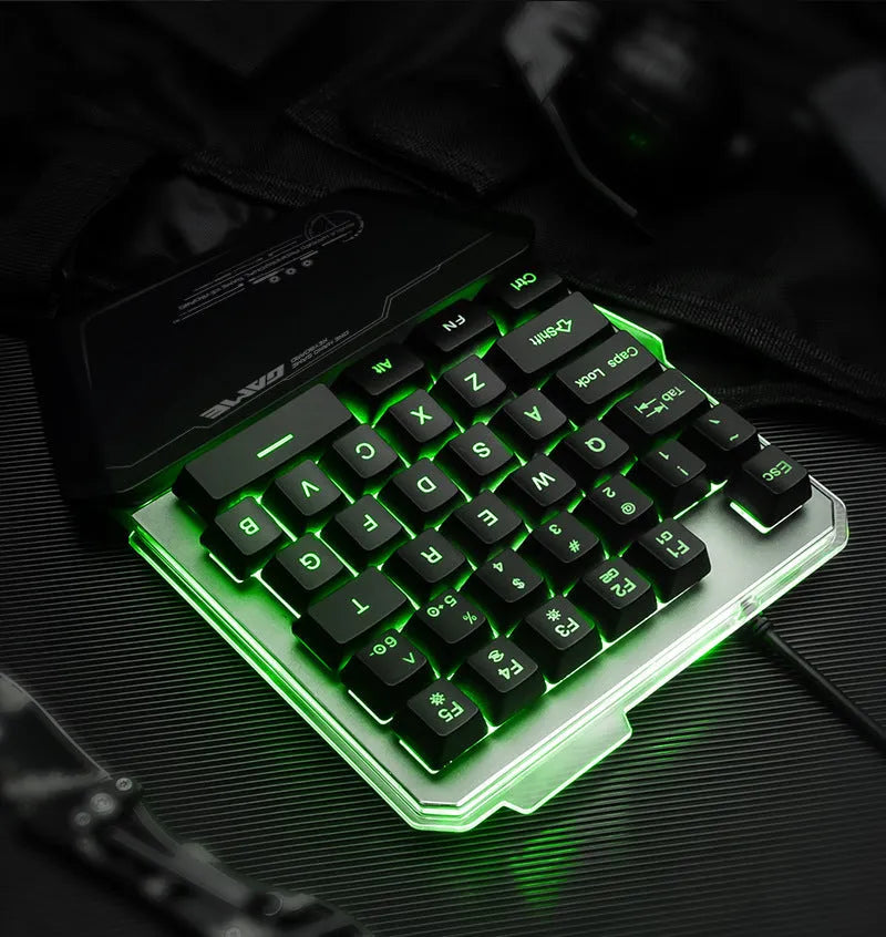 Black G40 Flow one-handed mechanical keyboard with RGB backlit keys on a desk