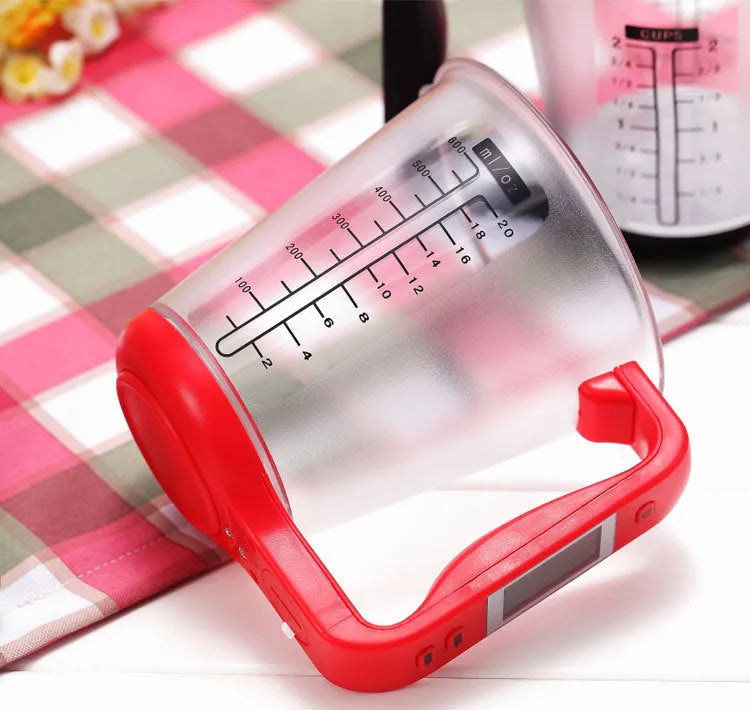Green electronic kitchen scale measuring cup with LCD display in handle