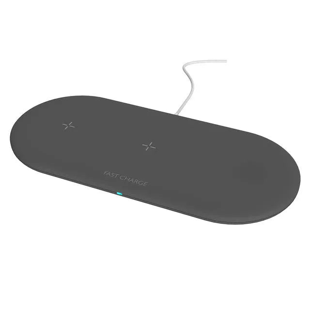 Black three-in-one wireless charging dock for iPhone, Apple Watch and wireless earbuds on a desk