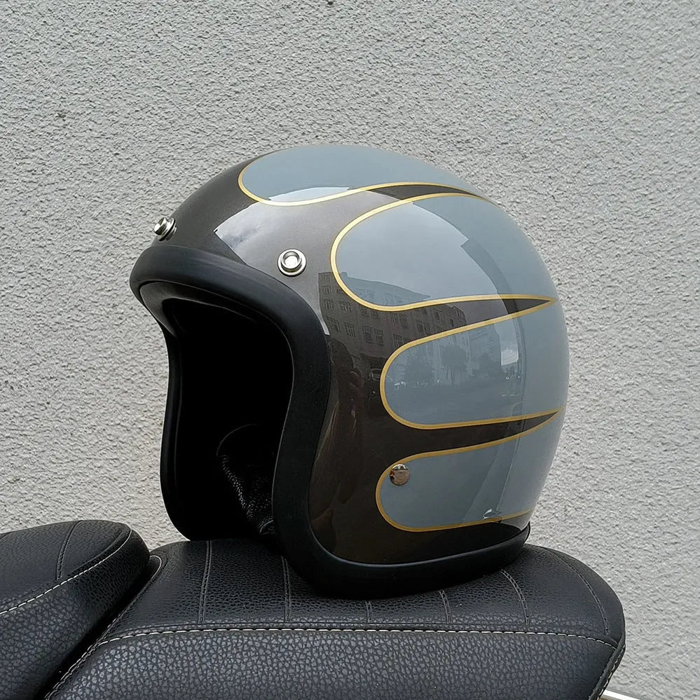 Retro-style motorcycle half helmet in cement grey with a glossy fibreglass shell on a plain background.
