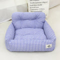 Grey and blue plaid cloth dog nest mounted in a car for pet travel.
