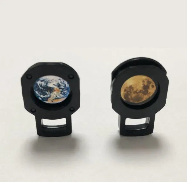 Earth and Moon star projection lamp with flexible hose bracket on a table