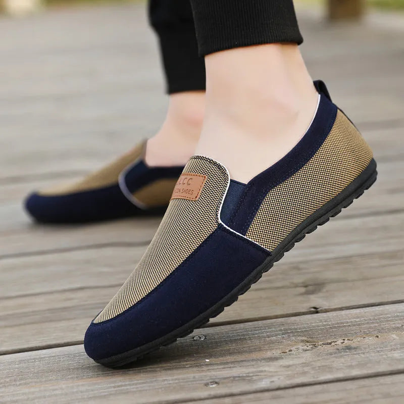 Men's grey and khaki canvas casual board shoes with round toe and rubber sole.