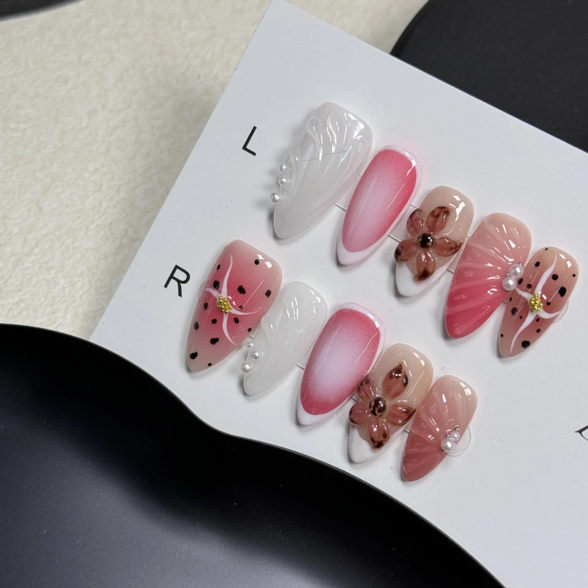 Hand-painted three-dimensional false nails with embossed carved patterns in candy colours.