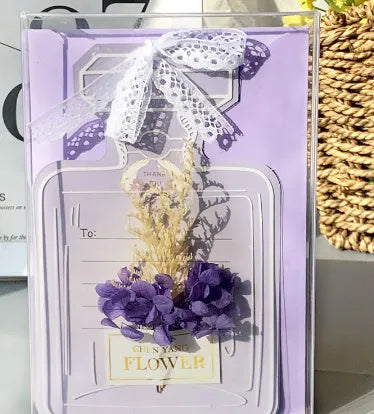 Handmade 3D butterfly-shaped birthday card with artificial flowers, shown with its matching envelope.