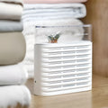 White recyclable cabinet dehumidifier box with transparent top showing colour-changing beads.
