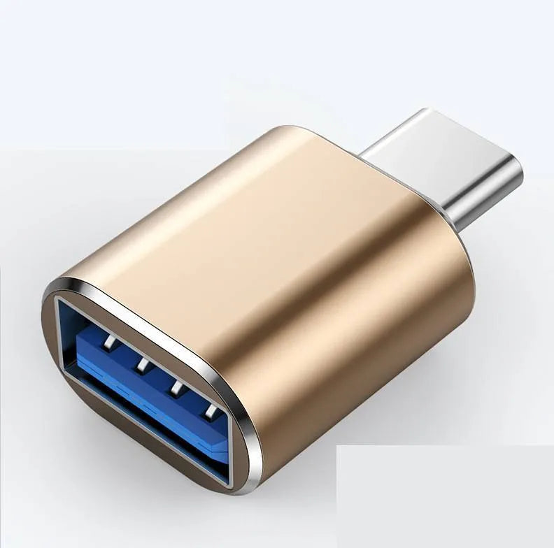 USB Type-C male to USB-A female OTG adapter shown in black, silver, and gold colour options.