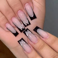 French style false nails with glitter butterfly design in medium length on a nail wheel.