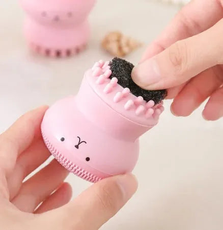 Cartoon octopus silicone wash brush in pink for manual facial cleansing and massage