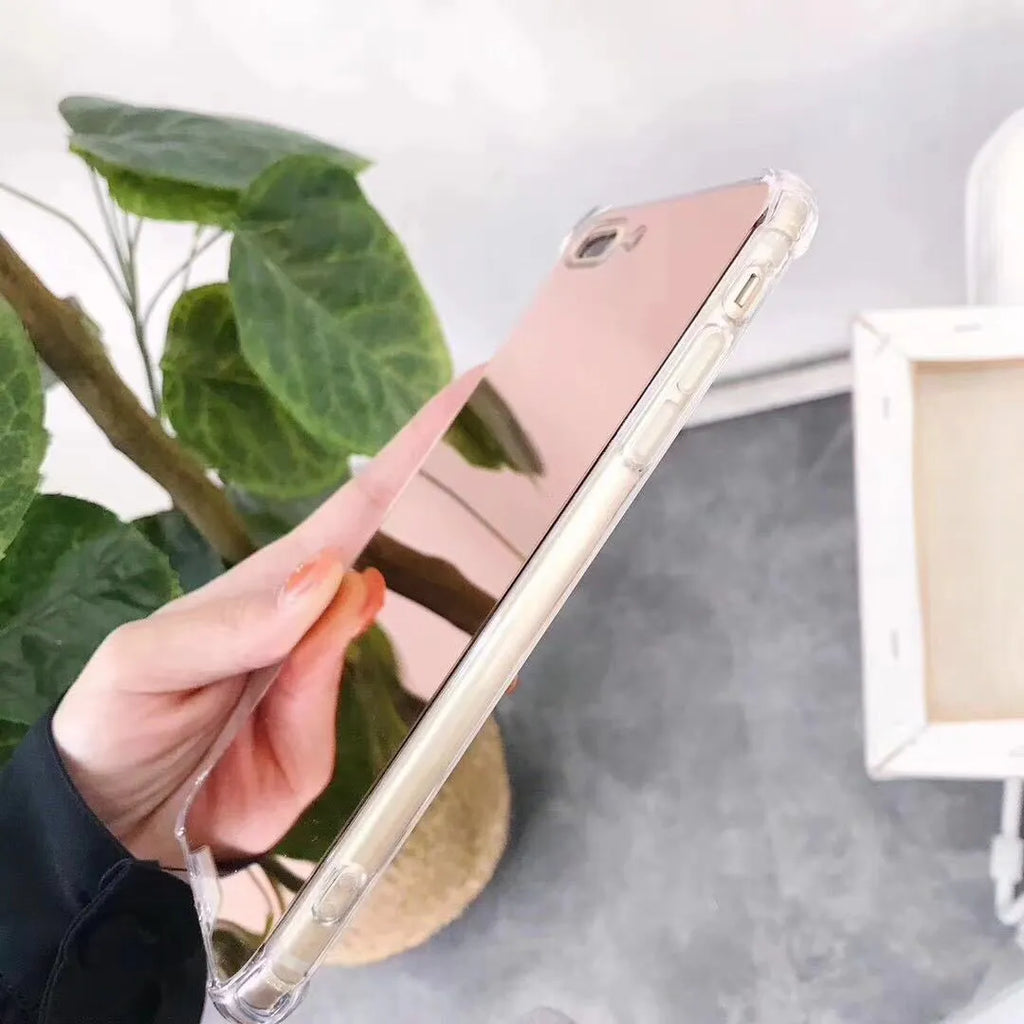 TPU mirror phone case for iPhone on a table, showing anti-fingerprint finish.