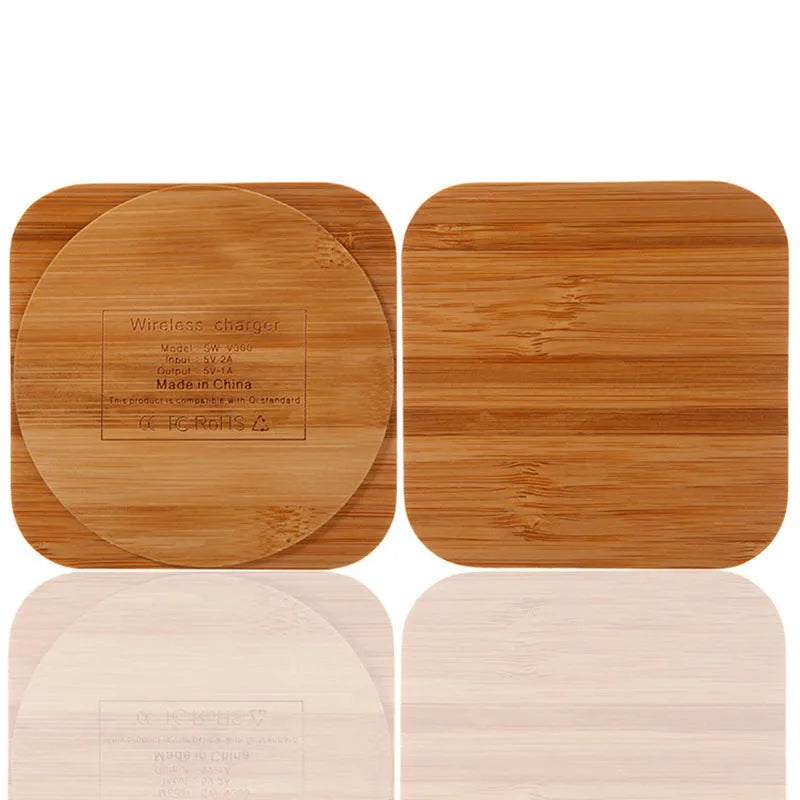 Square wooden bamboo 5W wireless charging pad on a table.