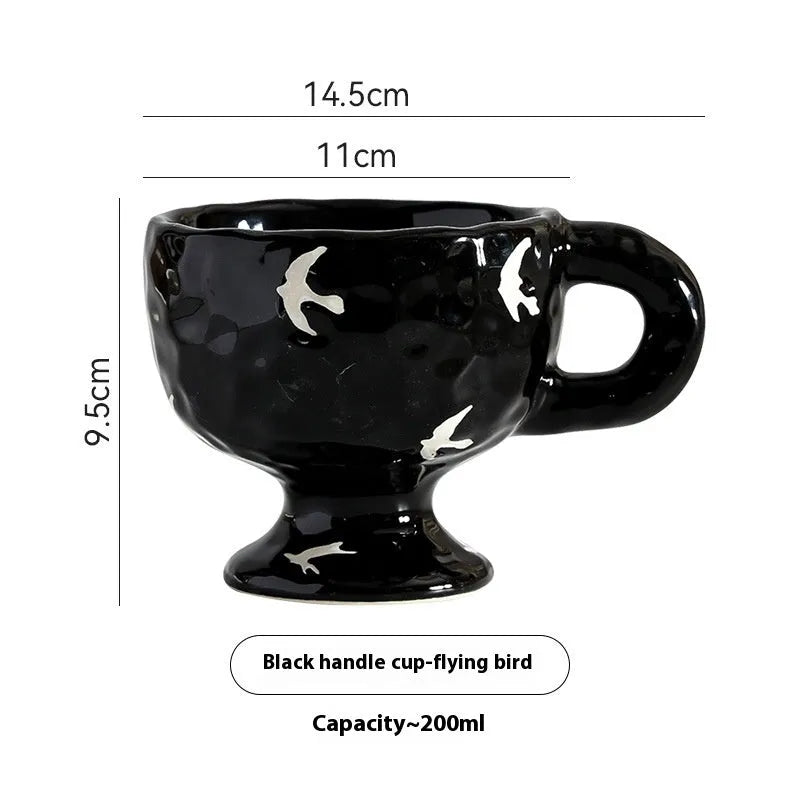 Hand-pinched irregular ceramic mug in a solid colour, showing its unique shape and modern design.