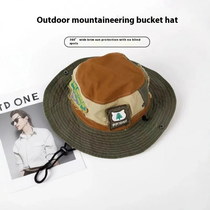 Army green cotton fisherman hat with a patchwork design and a flat-top crown.