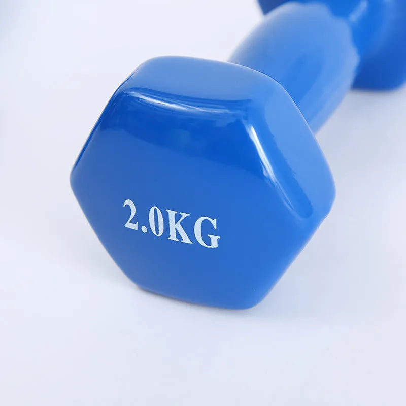 Colourful plastic fitness dumbbells in 0.5kg, 1kg, and 1.5kg weights with glossy surface