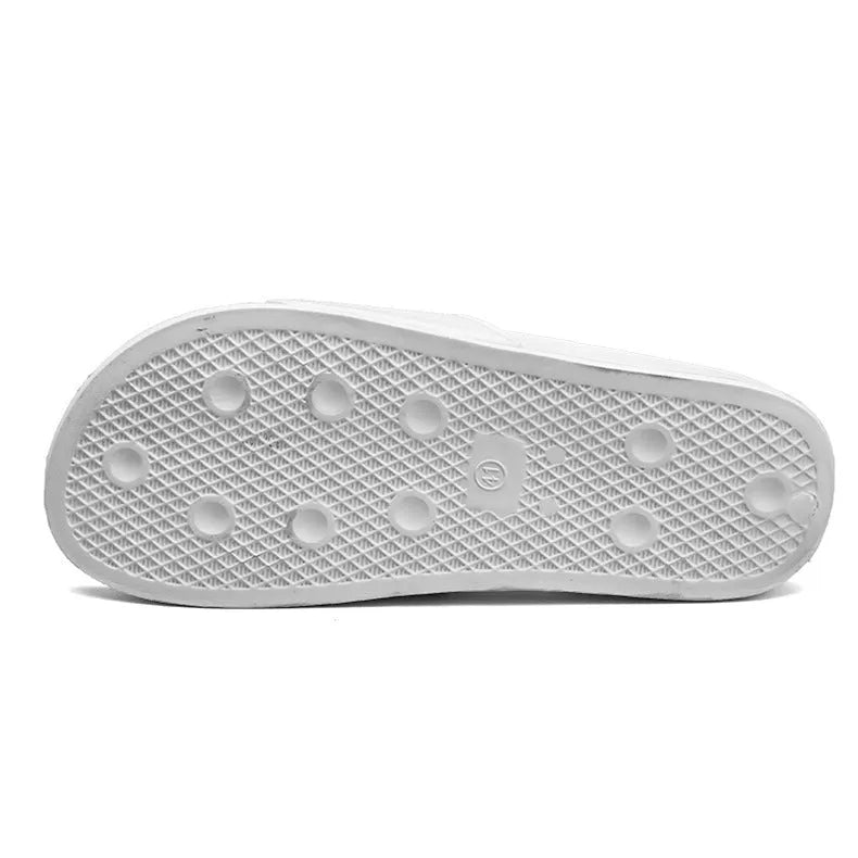 A pair of open-toe men's slippers with a rubber sole, shown in black and white colour options.