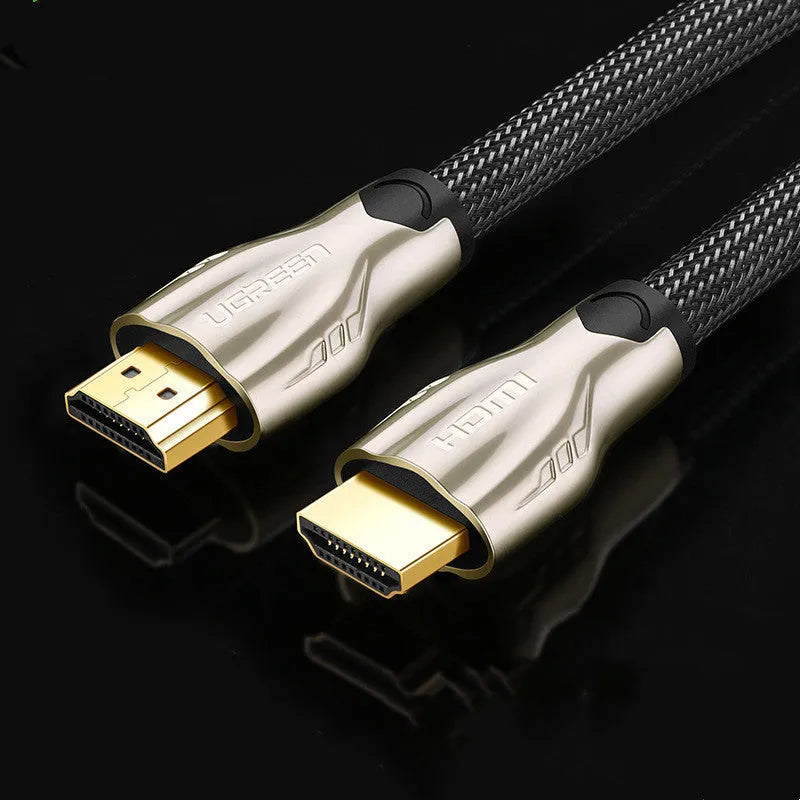 Close-up of a black HDMI cable with gold-plated connectors, showing its triple-shielded construction and PVC jacket.