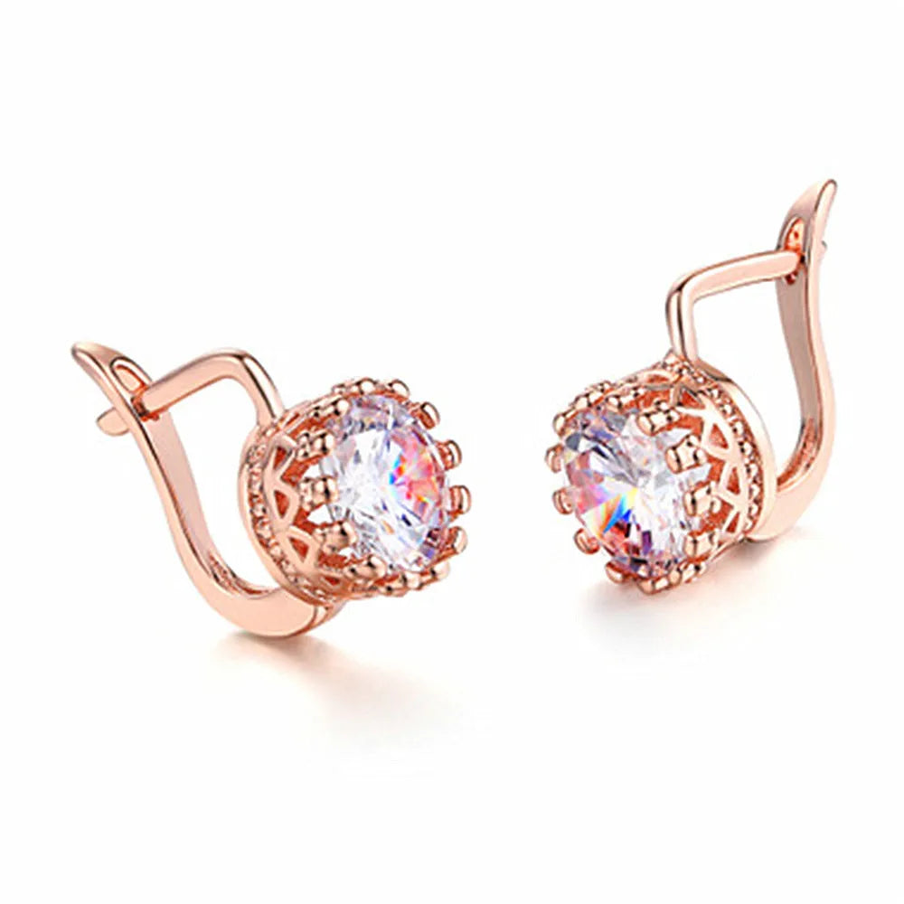 A pair of Korean retro crown-shaped clip-on earrings with a white diamond centre, in a rose gold finish.