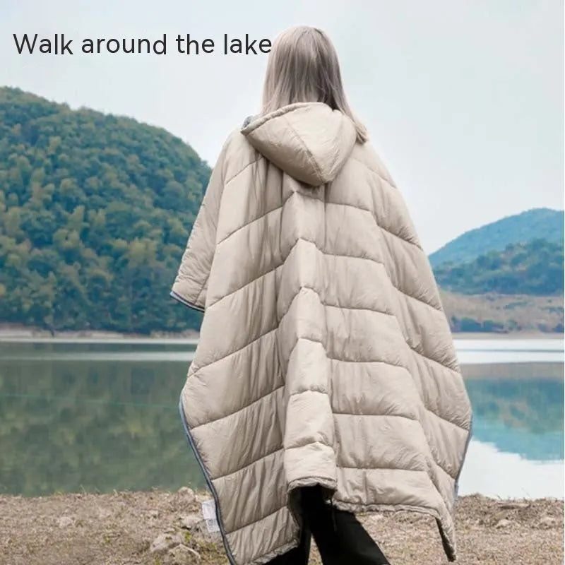 Outdoor cloak sleeping bag in grey or army green, showing wearable cape configuration and flat blanket layout