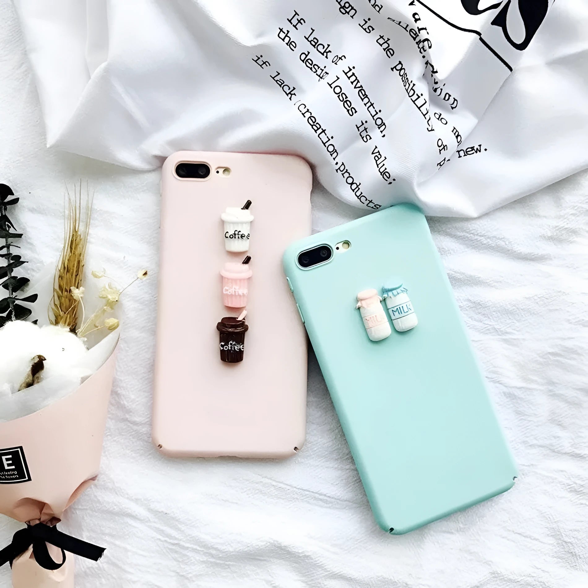 Soft pink silicone iPhone case with a raised 3D white cartoon cat design on the back.